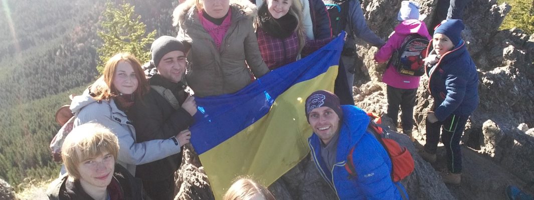 Ukrainian flag is on the mountain
