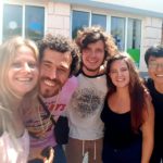 5 young people are smiling at the camera